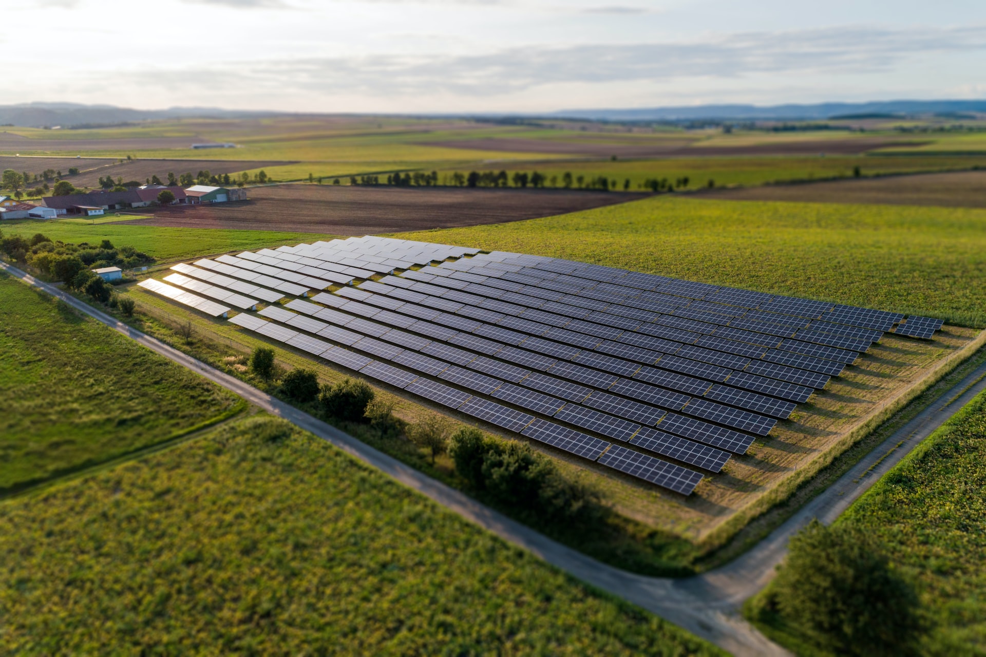 black solar panels on green grass field during daytime